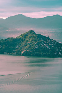 Scenic view of land against sky during sunset