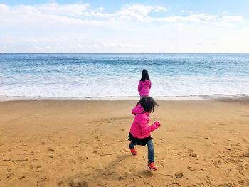 Sisters enjoying at beach