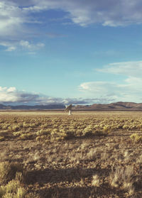 Scenic view of vla dish antenna in a field against sky