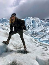 Woman standing on glacier 