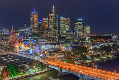 High angle view of illuminated city buildings at night