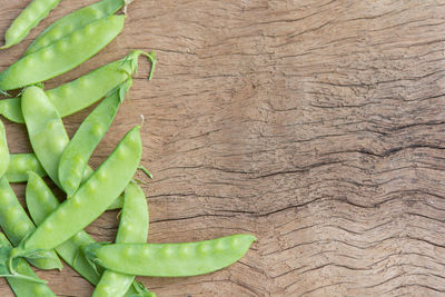 High angle view of fresh green leaves on table