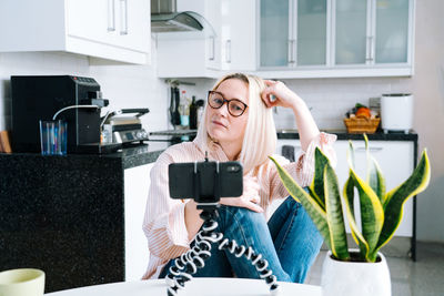 Woman talking on video call at home