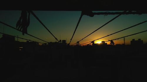 Silhouette of city at sunset