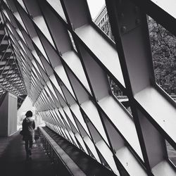 Rear view of woman walking in seattle public library