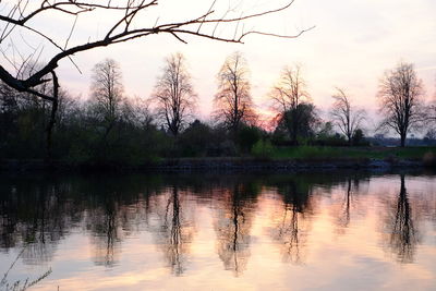 Scenic view of lake against sky at sunset