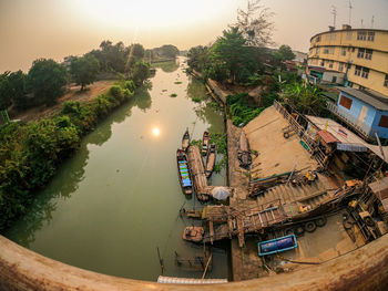 High angle view of river amidst trees against sky