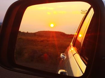 Reflection of sky on side-view mirror