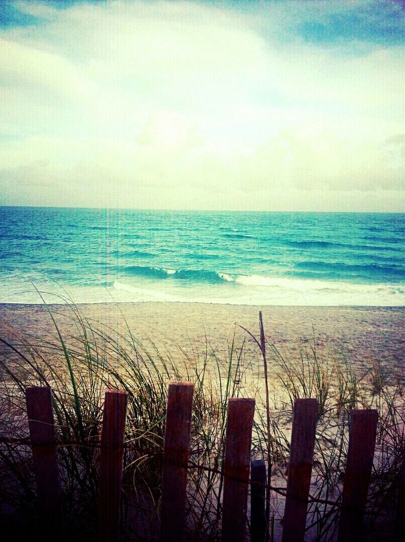 sea, horizon over water, water, beach, sky, scenics, tranquil scene, tranquility, shore, beauty in nature, nature, fence, railing, idyllic, cloud - sky, sand, outdoors, cloud, no people, day