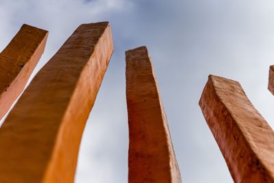 Low angle view of metallic structure against sky