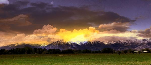 Scenic view of landscape against cloudy sky