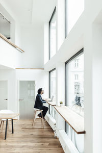 Man sitting on table at home