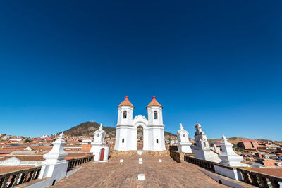 Low angle view of church against blue sky