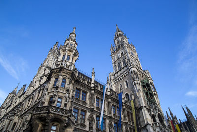 Low angle view of historical building against blue sky