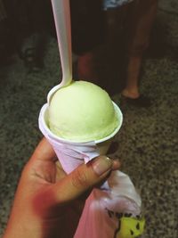 Cropped hand holding ice cream