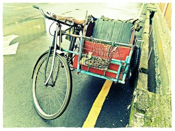 Close-up of bicycle against wall