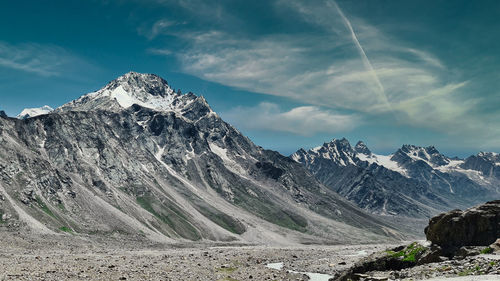 Scenic view of snow capped mountains against sky