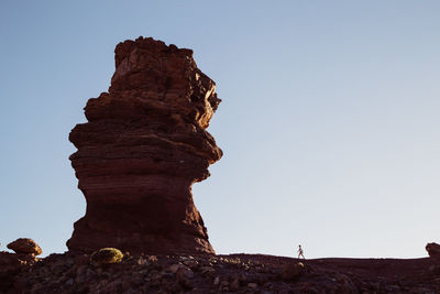 Low angle view of rock against clear sky