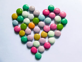 High angle view of colorful balls against white background