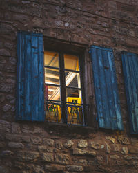 Low angle view of window of old building