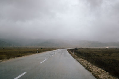 Empty road along landscape