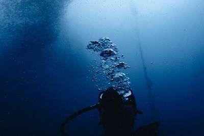 Close-up of person swimming underwater