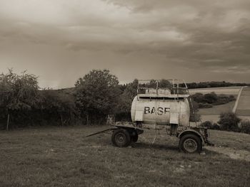 Tractor on field against sky