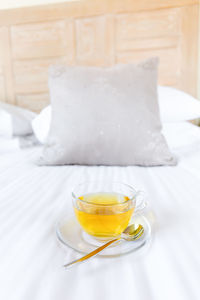 View of green tea on bed