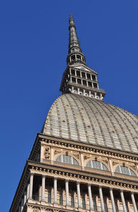 Low angle view of building against clear blue sky