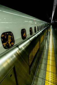 Train at railroad station at night