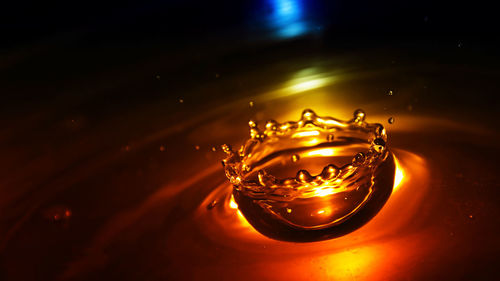 Close-up of water splashing in illuminated light