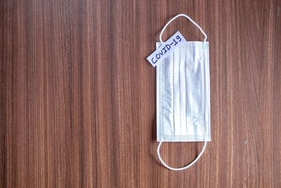 Directly above shot of paper hanging on wood