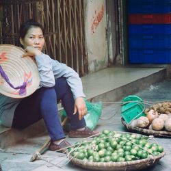 Woman sitting at market stall