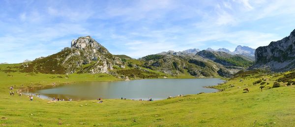 Scenic view of lake and mountains against sky