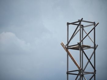 Low angle view of communications tower against sky