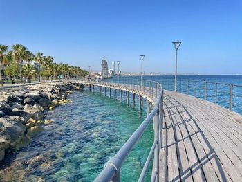 Pier over sea against sky