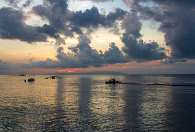 Scenic view of sea at sunset