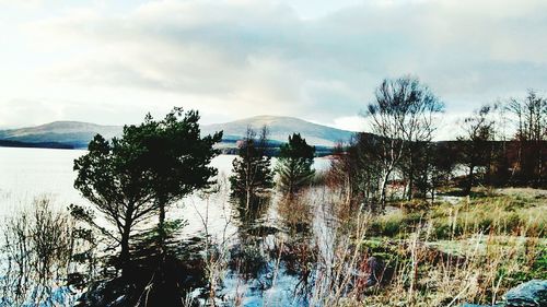 Scenic view of sea against cloudy sky