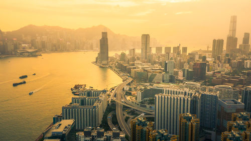 High angle view of buildings against sky during sunset