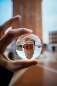 Close-up of hand holding glass