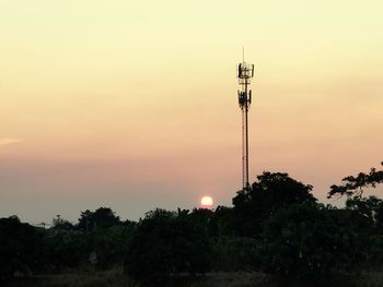 Silhouette tower against sky during sunset