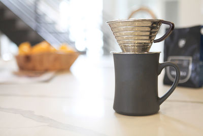 Close-up of coffee cup on table