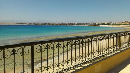 View of railing by sea