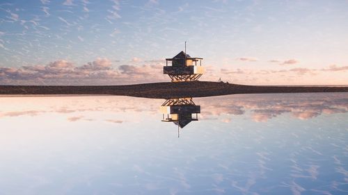 Scenic view of lake against sky during sunset