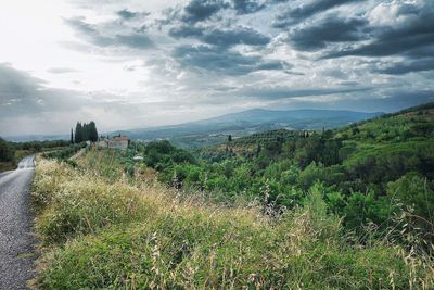 Scenic view of landscape against cloudy sky