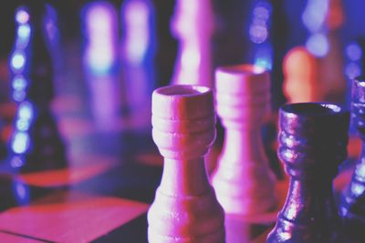 Close-up of chess pieces on table