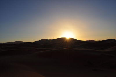 Scenic view of mountains against sky during sunset