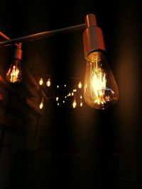 Close-up of illuminated light bulb