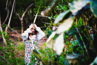 Young woman photographing outdoors