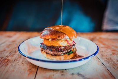 Close-up of burger in plate on table